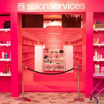 Sally Beauty x Salon Services Salon International goody bag stand.